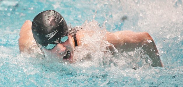 Inglemoor High’s Kyle Komlodi breathes to the side during the finals of the 100-yard butterfly last Saturday at the 4A state meet in Federal Way. Komlodi placed seventh.