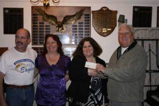 The Eagles Bothell Aerie 2609 presented the Cancer Institute at Virginia Mason with a $2