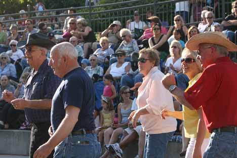 Line dancers get rolling to Jonathan Harris' country tunes last Friday at the Park at Bothell Landing.