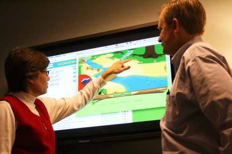 McGraw-Hill’s Polly Stansell  and Randall Reina discuss the video-game-like math program Planet Turtle last Friday at their Bothell office.