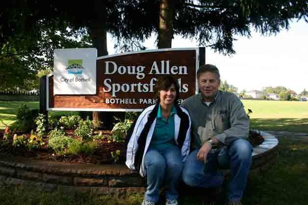 Joanne and Steven Allen sit at the Bothell sportsfields that honor their son