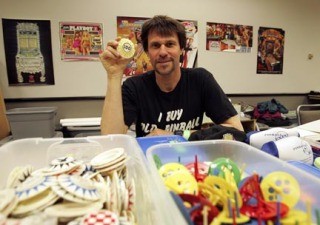 Jeff Stern shows off his wares while selling parts for classic pinball machines during the Northwest Pinball and Gameroom Show at the Seattle Center on June 6.