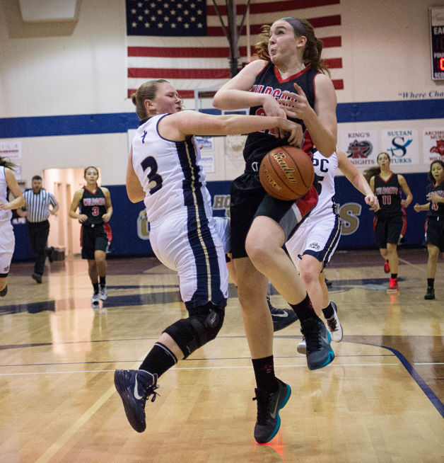 Arch Bishop Murray’s Addie Schmidt gets the ball knocked loose by Cedar Park’s Kristan Barclay.