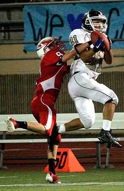 Cedar Park Christian's Ben Fuchs hauls in a pass against Life Christian.