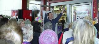 Ostroms Drug and Gift Owner Todd Ramsey welcomes a throng of customers to the Kenmore store at 9 a.m. sharp Wednesday for its closing sale. Some people lined up an hour before opening. Some items are up to 75 percent off through April