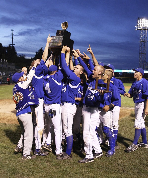 The Bothell High boys' baseball team hoists the 4A state championship trophy after defeating No. 1-ranked Jackson
