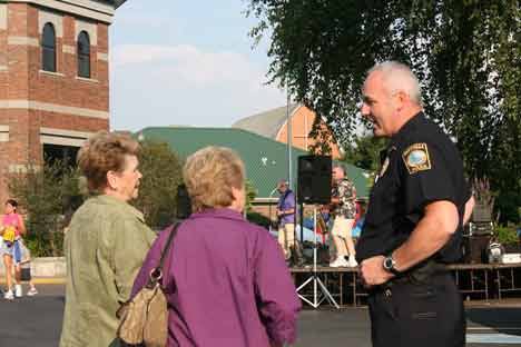 Bothell Police Department Deputy Chief Henry Simon talks with Marlies Rettenbacher