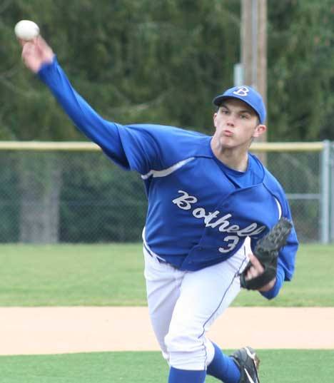 Bothell High's Jordan Kynaston fires away in the first inning of the Cougars' 8-6 win over Woodinville High yesterday at Bothell. Kynaston upped his record to 2-0 this season. Leading the way offensively for Bothell (1-1 in 4A Kingco