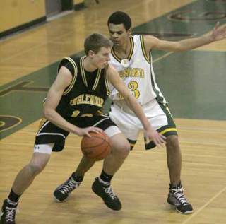 Redmond High’s Dominique Redeau guards Inglemoor High’s Todd Campbell during a Dec. 16 4A Kingco matchup at Redmond.