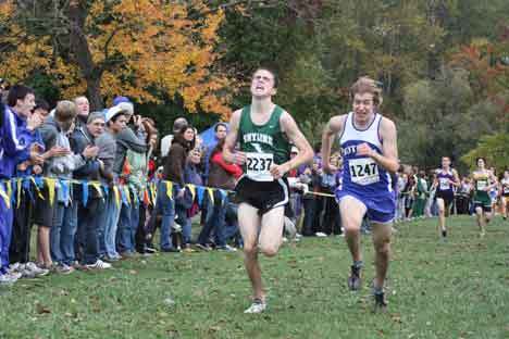 Skyline High's Kyle Branch and Bothell High's Kevin Holmes race for the finish line at last Thursday's 4A Kingco cross-country championship meet at Lake Sammamish Park. Branch edged out Holmes at the finish.