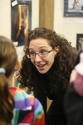 Northshore Council PTA 'Reflections' co-chair Melissa Graham visits with a young artist at last Saturday's student art gallery and open house at Northlake Lutheran Church in Kenmore.