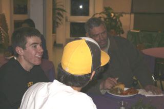 Inglemoor High Key Club Vice President Jason Nadeau and his friends chat with Tent City IV resident Dan Sumner