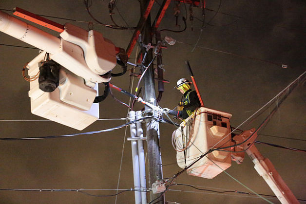Puget Sound Energy crews work to reconnect power for Eastside residents.