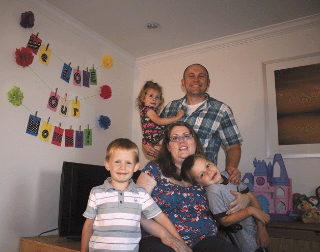 Krystal and Tom Warwick with their three children.