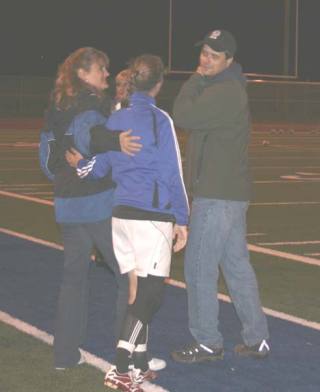 Bothell High senior soccer player Leah Perrault chats with her parents
