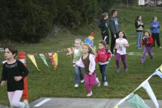 A group of kindergarten girls complete their run Oct. 28 at the Great Pumpkin Race
