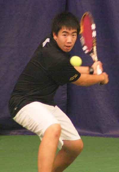 Inglemoor High's Trevor Shih swings away during Thursday's 4A Kingco tennis championships at the University of Washington. Shih and partner Stefan Bach defeated Redmond's Ahmed Jafri and Jorel Murray