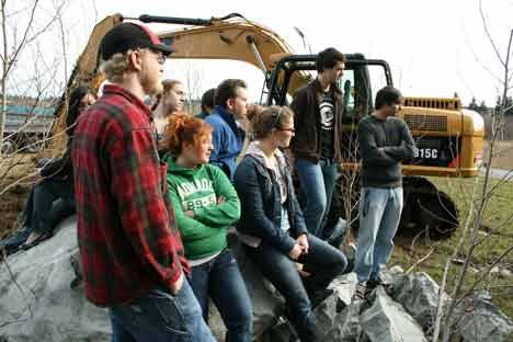 Gathered on top and around a glacial boulder believed to be 12