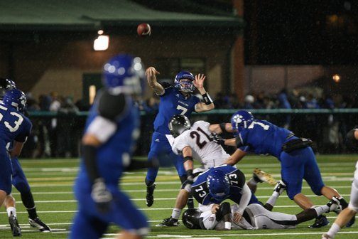 Bothell's Braden Foley unleashes a touchdown pass to Trent Sewell during Friday night's game.