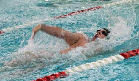 Viking Craig Olynyk blasts through the water during the 100-yard backstroke at Mercer Island’s Mary Wayte Pool. Olynyk won the race in 55.98 seconds. Inglemoor defeated Bellevue