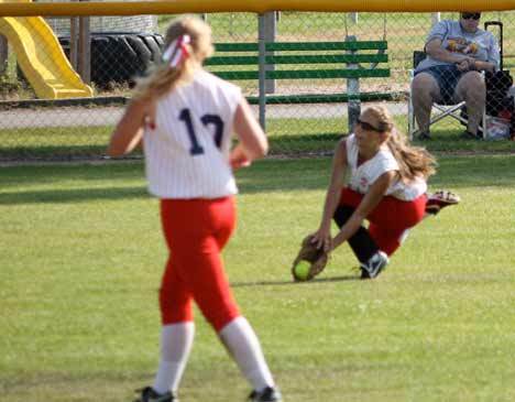 North Bothell center fielder Rory Peterson snags a flyball as shortstop Tracy Rider prepares to assist during Washington's Game 3 of the Senior Softball Western Regional Tournament last Saturday in Missoula