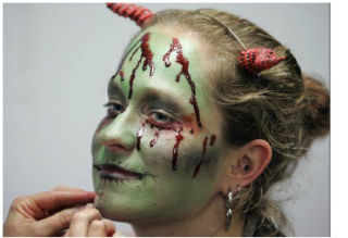 Abby Hutton gets her face painted by a make-up artist during last Friday’s opening of Haunted Trails at Bastyr University. The event next takes place from 5:30-10 p.m. Oct. 24-25.