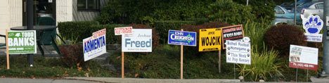 It's signs aplenty on the corner of state routes 522 and 527 in downtown Bothell. Candidates for school board