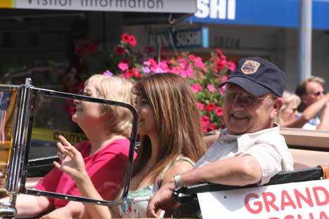 Grand Marshal David Bothell and his family cruise down Main Street during last Saturday's Fourth of July Grand Parade. Also on tap was a Battle of Concord re-enactment at the Park at Bothell Landing and a fireworks display at Log Boom Park in Kenmore.