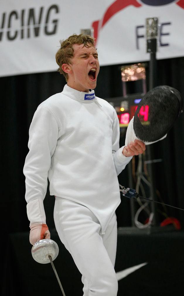 Bothell resident Matthew Comes reacts to winning one of his fencing duels.