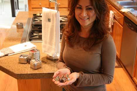 Cindy Sawyer displays her ToweLocs in her Bothell kitchen.