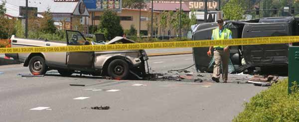 An investigator surveys the scene of an injury accident this morning on State Route 522 in Kenmore.