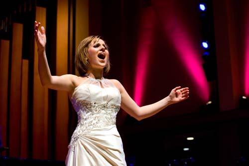 Inglemoor High graduate Rachel DeShon belts out a song last weekend at the Holiday Pops Concerts with composer Marvin Hamlisch at Benaroya Hall