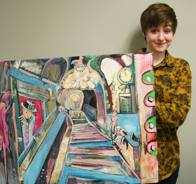 Kenmore resident Sam Carey shows off one of her oil paintings.
