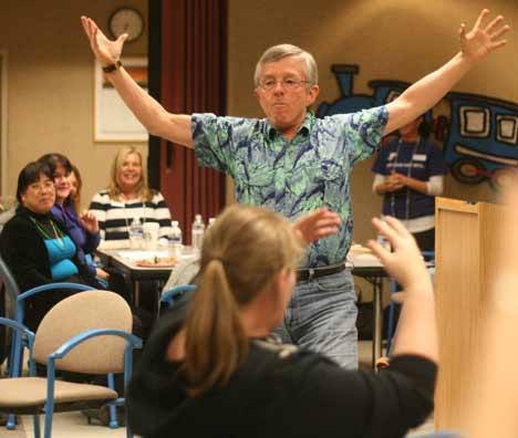 Erv Desmet gets his fellow fund-raisers fired up at last week's Northshore YMCA 2012 Partners With Youth Annual Giving Campaign rally meeting at the Seattle Times building in Bothell.