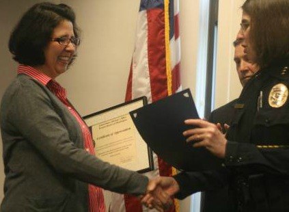 Bothell Police Department Chief Carol Cummings congratulates Kenmore resident Cherie (last name withheld) this morning for calling police in December 2010 and helping dismantle an ATM 'skimming' ring.