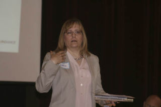 Businesswoman Louise Holder makes a point while speaking at the Greater Bothell Chamber of Commerce morning meeting last Thursday at the Northshore Senior Center. She owns Holder’s Ink in Kirkland. ANDY NYSTROM