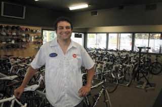 Co-owner Greg Pergament is surrounded by two-wheelers at his new Bothell Ski and Bike location. TOM CORRIGAN