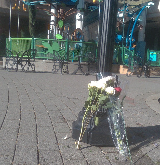 Flowers mark where the child was struck by a Kenmore driver.