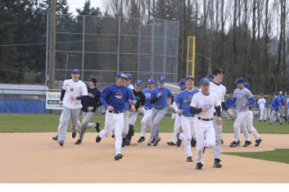 Bothell High athletes got into the swing of things during last Wednesday’s spring practices. The Cougar baseball team rounds second base at the start of practice.  PHOTO BY ANDY NYSTROM