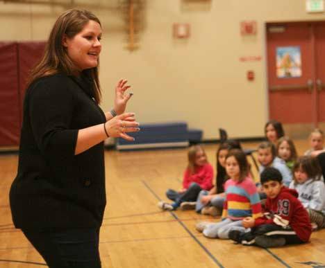 Instructor Allison Muennich of the Missoula Children's Theatre (MCT) helps Arrowhead Elementary kindergarten through sixth-grade students remember their lines last Thursday night in the school gym in preparation for last Saturday's performances of 'The Princess and the Pea.'