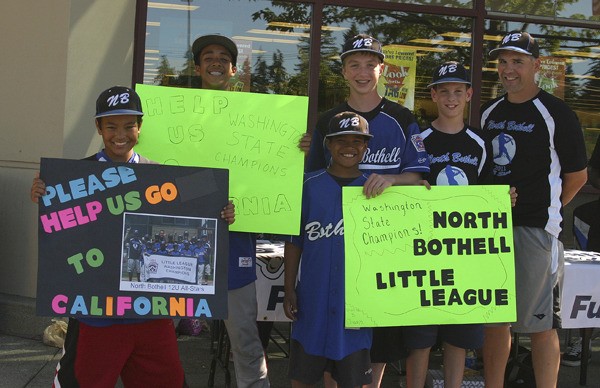 Boys from the North Bothell Little League team along with coach Mark Ryder (right) helped raise funds for their trip to the Regionals tournament in San Bernardino