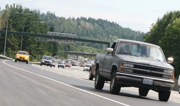 Motorists on the left zoom up the new northbound Interstate 405 lane in Bothell Friday afternoon.