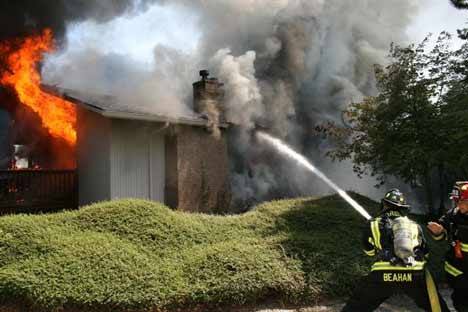 Northshore firefighters douse Monday's Lake Forest Park residential blaze.