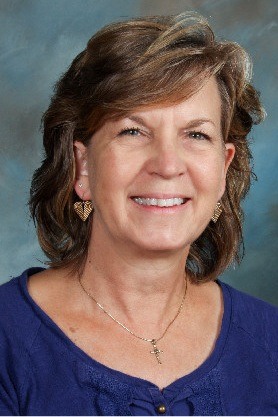 Kenmore Junior High teacher Debbie Montague is honored for her work.