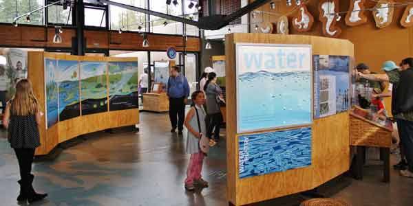 Visitors at the new Brightwater Clean-Water Treatment Facility learn about the treatment process in the Exhibit Hall during the grand opening on Sept. 24.