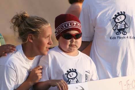Brandon Brauns hangs out with his cousin Ashley Hughes in July of 2009 at his soccer camp fund-raiser for the Fred Hutchinson Cancer Center.