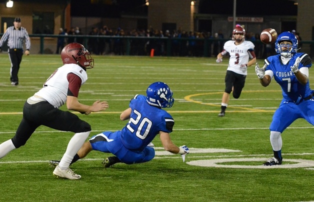 Bothell High School football player Jackson Keimig catches a pass originally tipped by Sam McPherson (20) during the team's game against Bethel Friday.