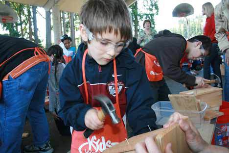 Students pound away on their birdhouses.