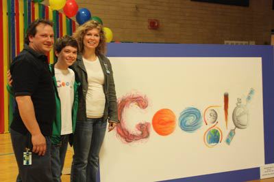 Braden Welke displays his Google artwork with parents Brad Welke and Cynthia Rigby.