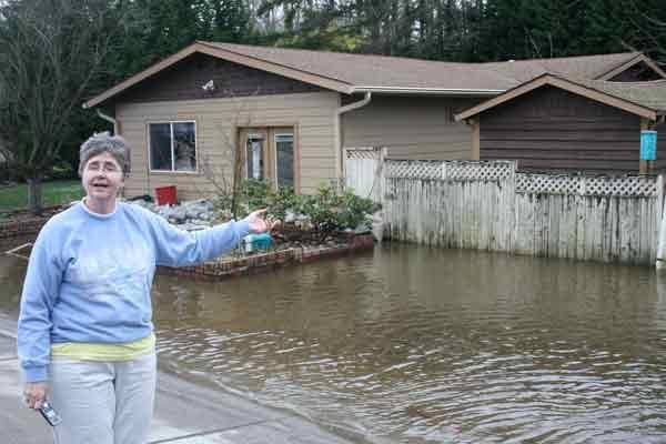 Kenmore resident Elizabeth 'Frankie' Schmitt stands in front of her 73rd Avenue Northeast home